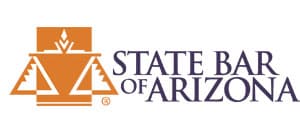 A circular emblem featuring a golden sunburst with a blue background and the words "State Bar of Arizona" - The Lawler Group